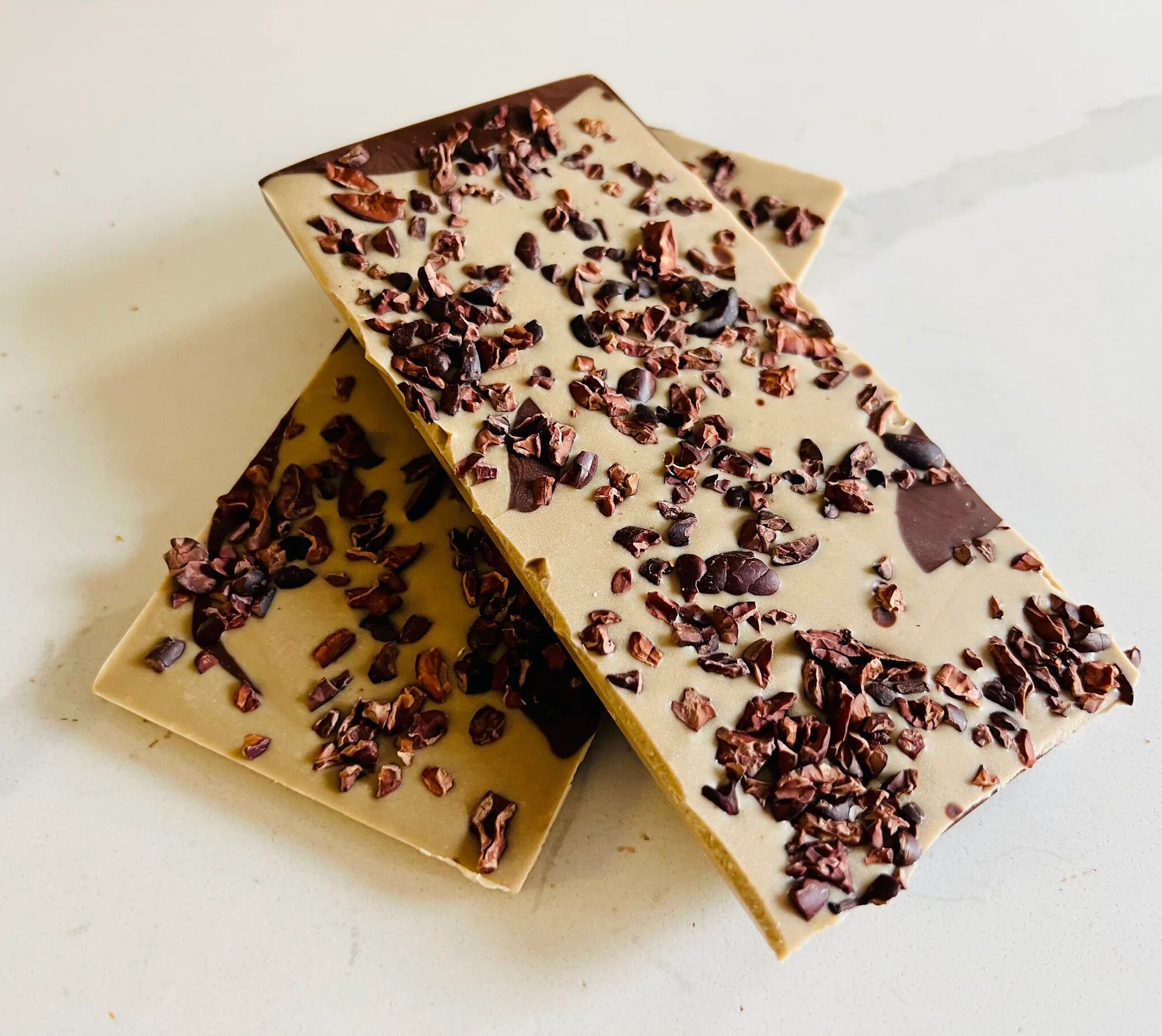 The Organic House Cookies & Cream White Mylk Chocolate Bar Open Lifestyle 2