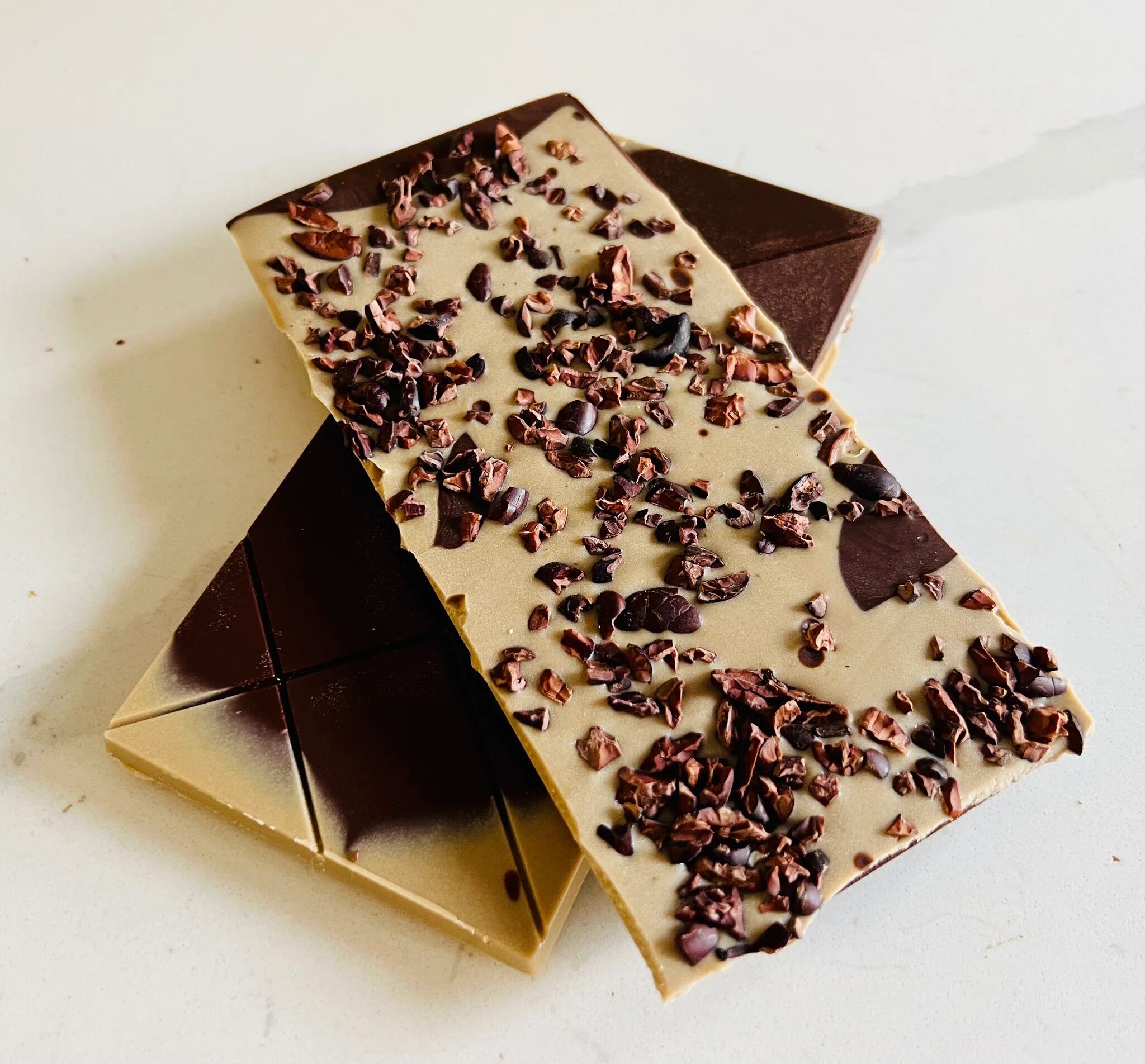 The Organic House Cookies & Cream White Mylk Chocolate Bar Open Lifestyle